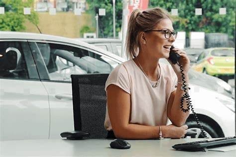 Account manager on the phone at her desk
